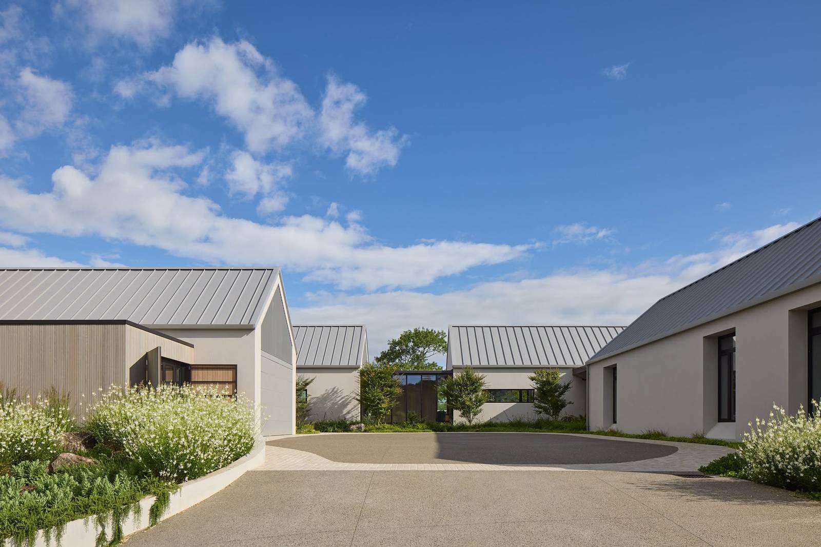Contemporary architectural home with a hand-applied exterior plaster finish, completed by Moloney Plasterers