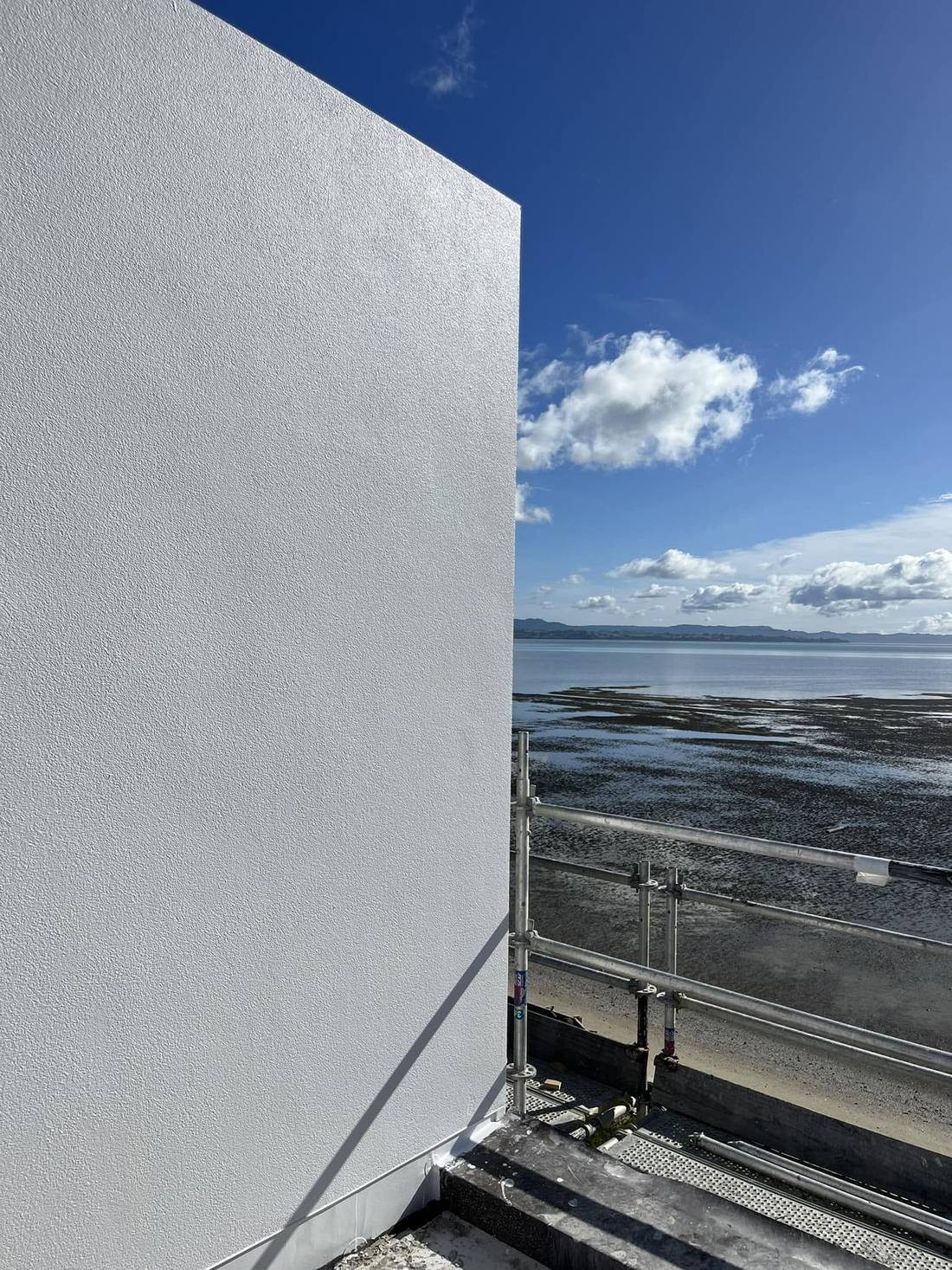 Burnished lime plaster applied to an interior wall, worked to a soft sheen
