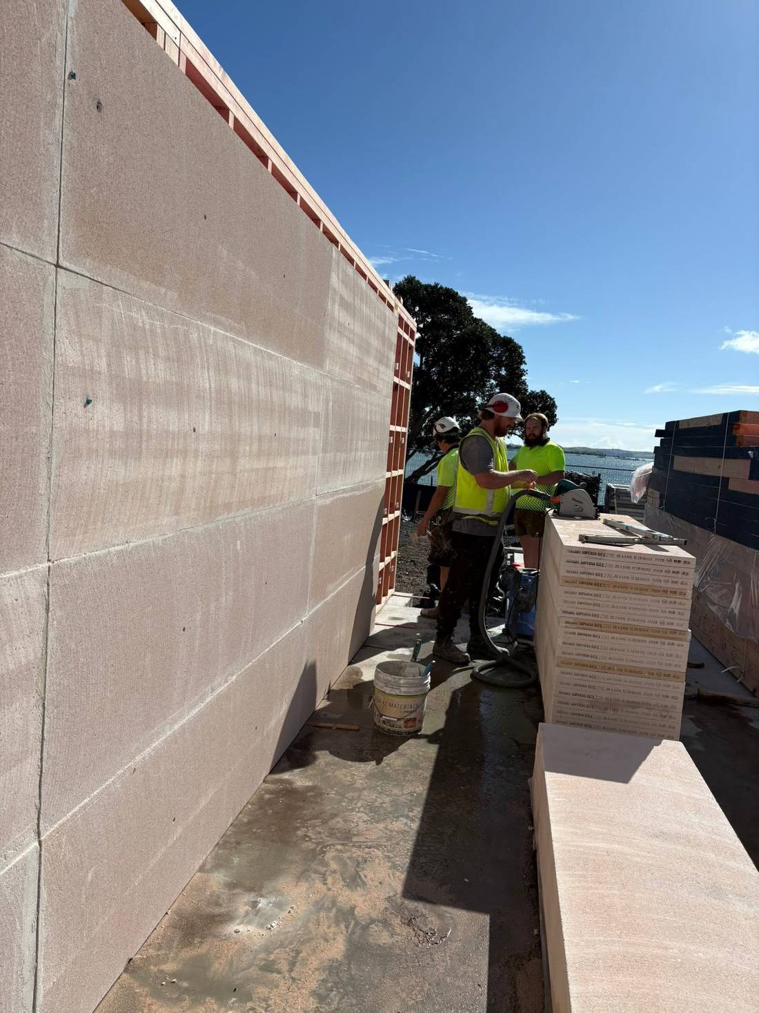 Plastered inter-tenancy firewall on a residential build, finished by the Moloney Plasterers crew